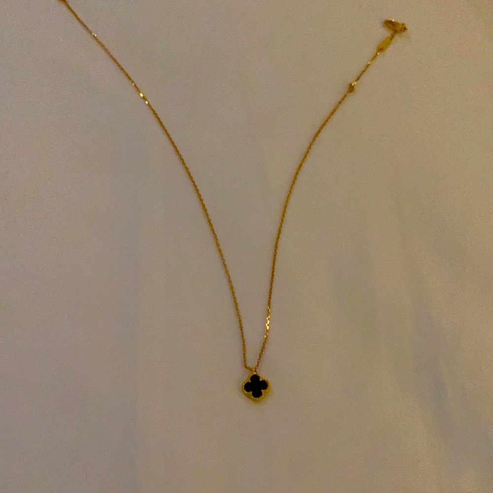 Black clover with gold necklace